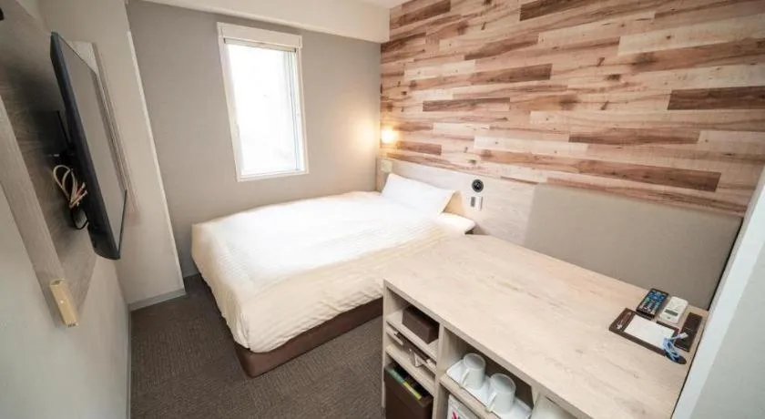 Bed in Super Hotel Hakodate