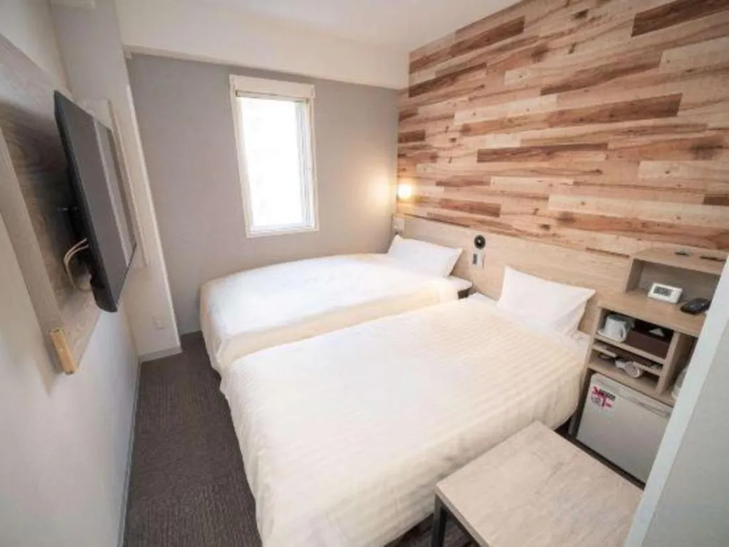 Bed in Super Hotel Hakodate