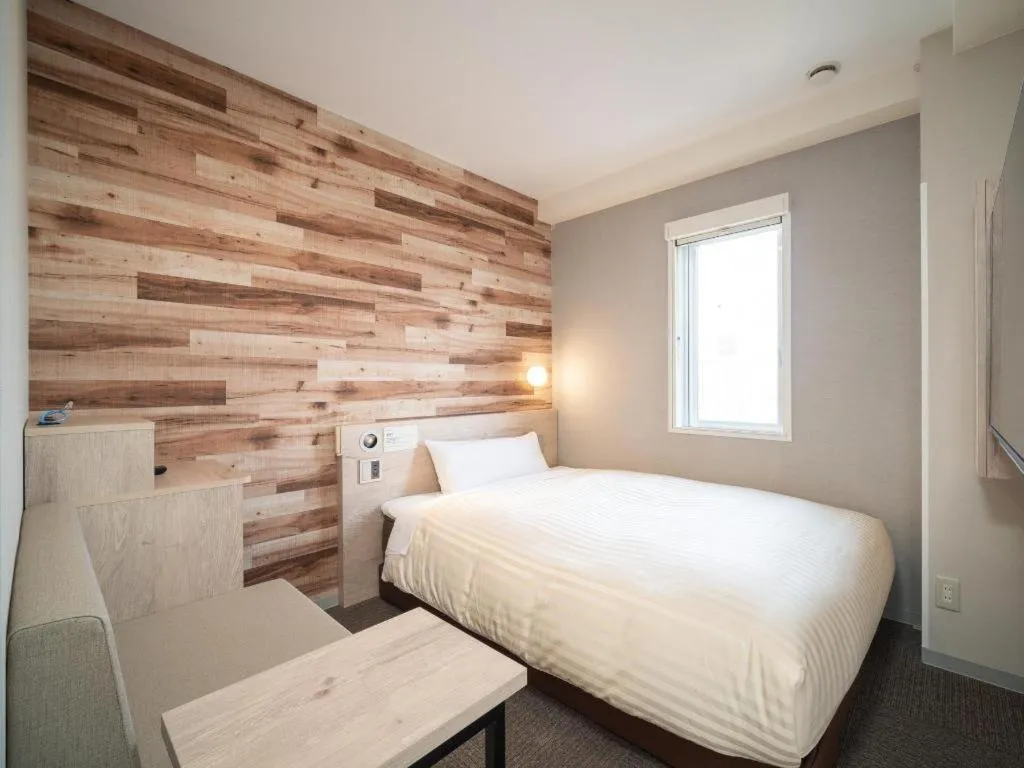 Bed in Super Hotel Hakodate