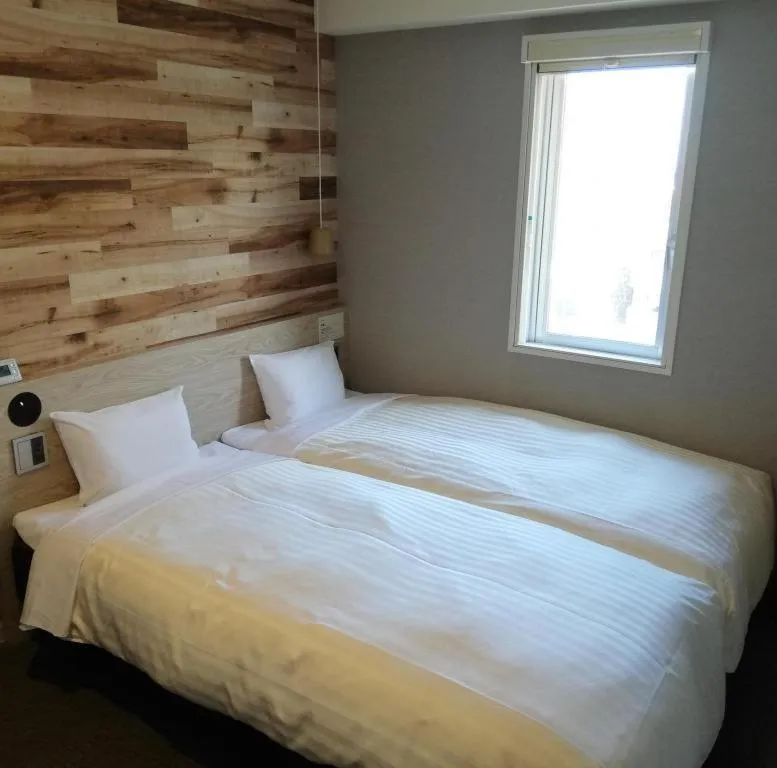 Bed in Super Hotel Hakodate