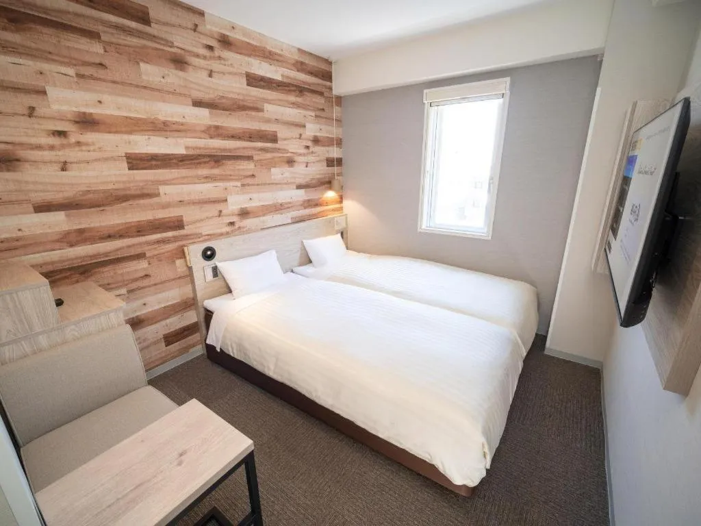 Bed in Super Hotel Hakodate