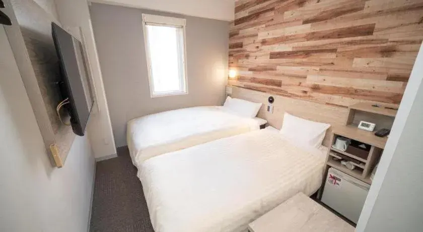 Bed in Super Hotel Hakodate Bed in Super Hotel Hakodate