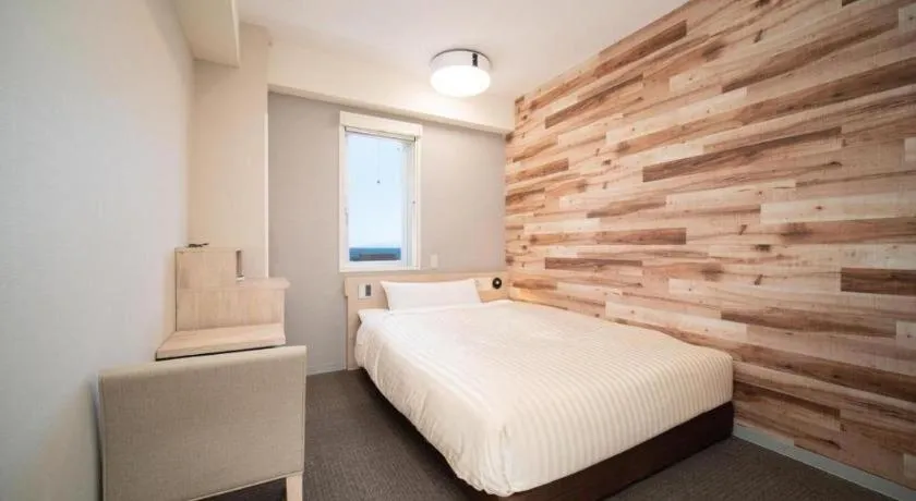 Bed in Super Hotel Hakodate