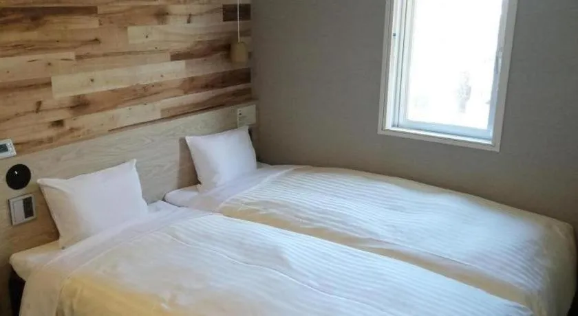 Bed in Super Hotel Hakodate