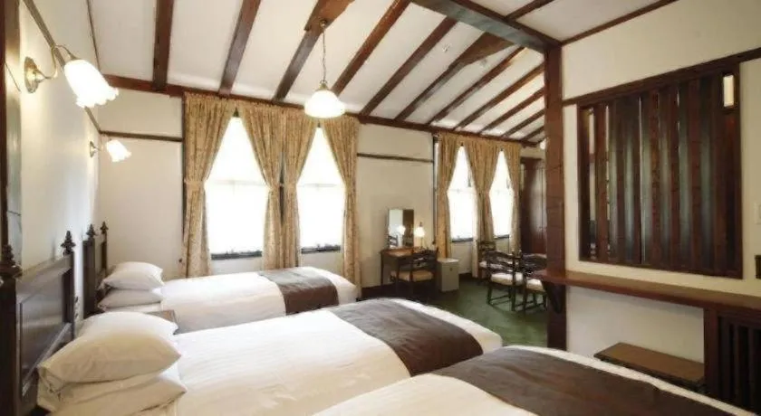 Bed in Unzen Kanko Hotel