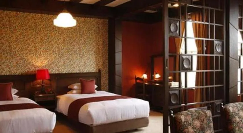 Bed in Unzen Kanko Hotel