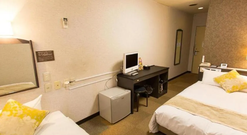 Bed in Hotel AreaOne Miyazaki City