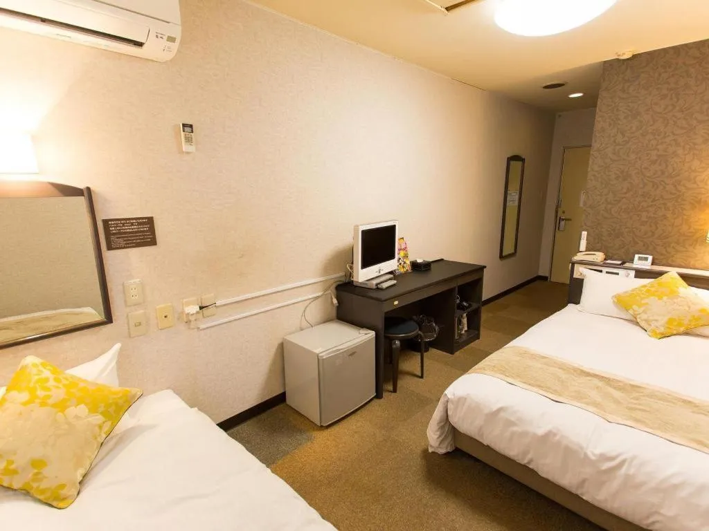 Bed in Hotel AreaOne Miyazaki City