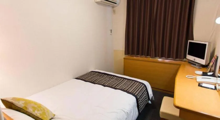 Bed in Hotel AreaOne Miyazaki City