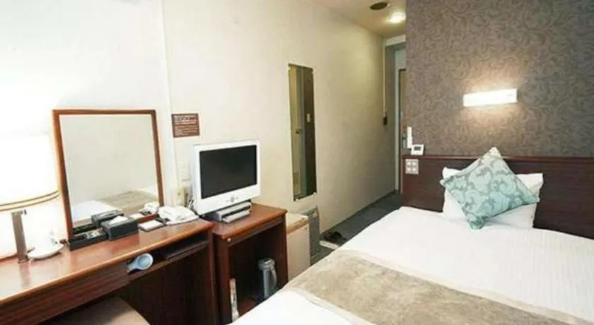 Bed in Hotel AreaOne Miyazaki City