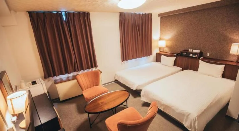 Bed in Hotel AreaOne Miyazaki City