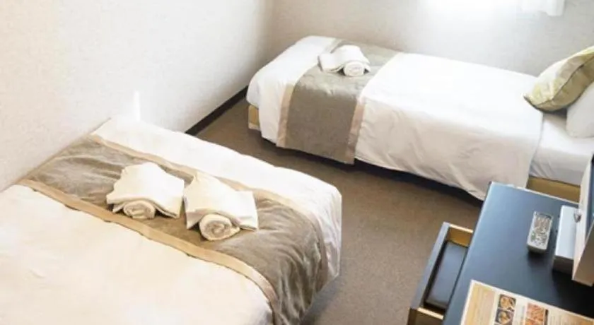 Bed in Hotel AreaOne Miyazaki City