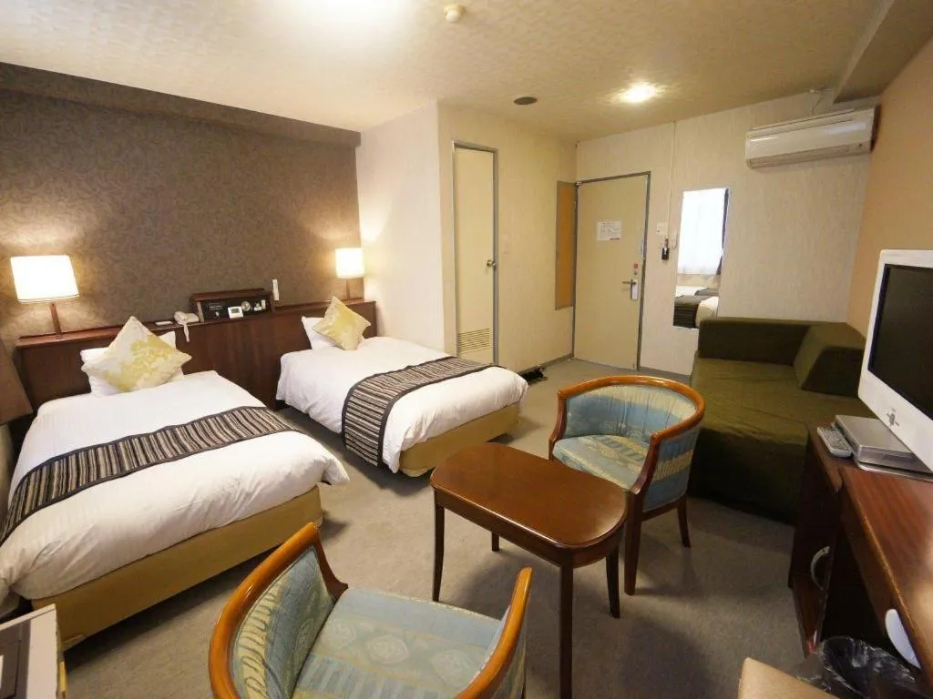 Bed in Hotel AreaOne Miyazaki City