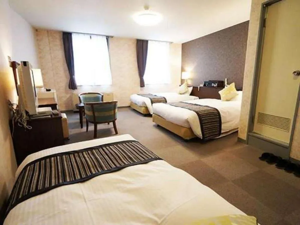 Bed in Hotel AreaOne Miyazaki City