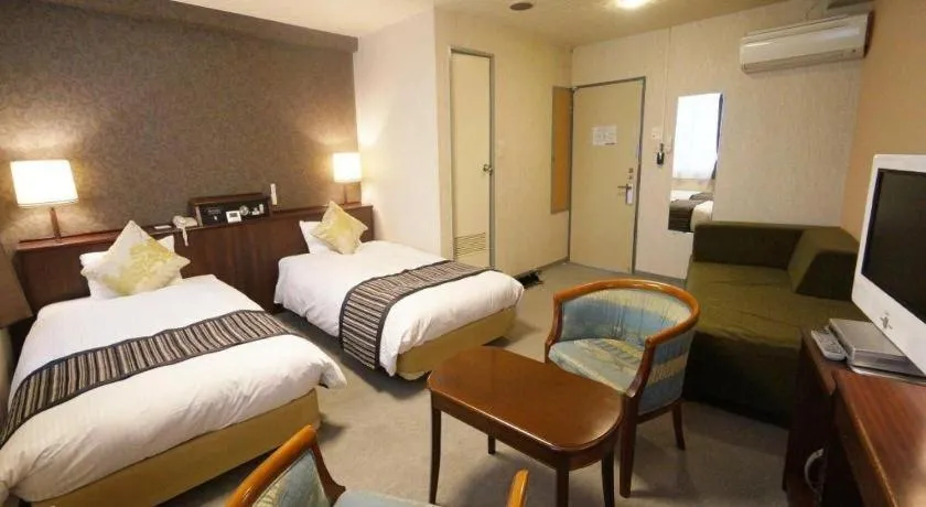 Bed in Hotel AreaOne Miyazaki City