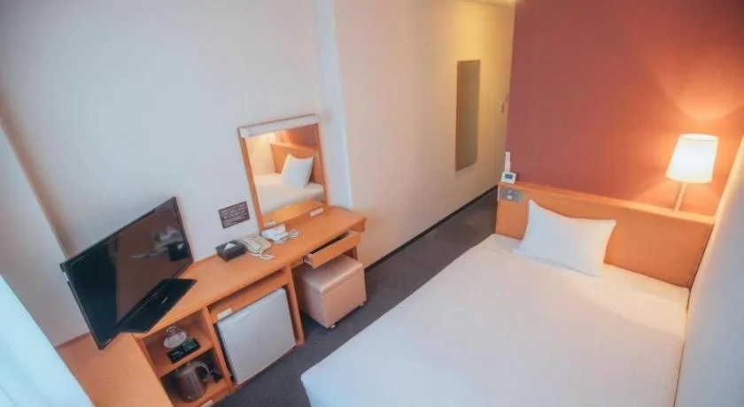 Bed in Hotel AreaOne Miyazaki City