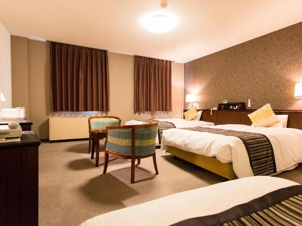 Bed in Hotel AreaOne Miyazaki City