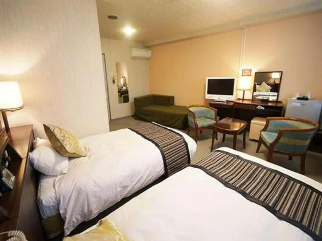 Bed in Hotel AreaOne Miyazaki City