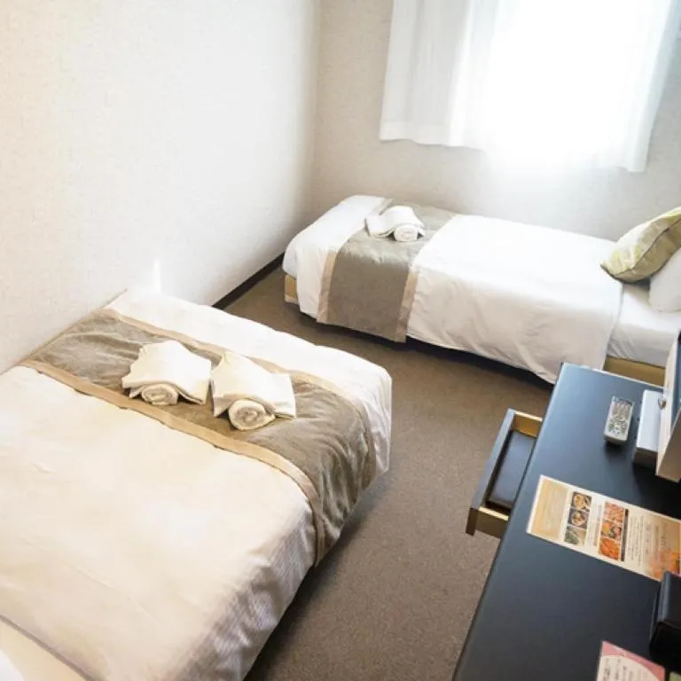 Bed in Hotel AreaOne Miyazaki City