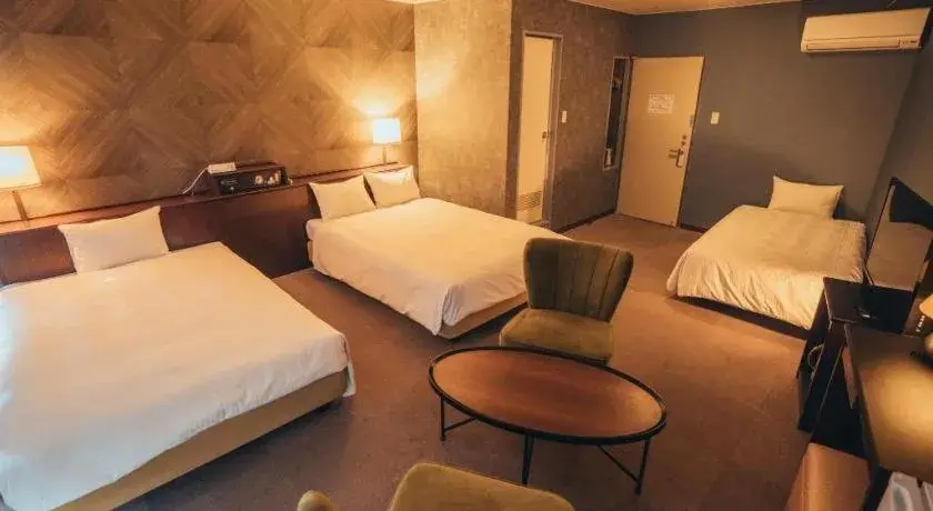 Bed in Hotel AreaOne Miyazaki City Bed in Hotel AreaOne Miyazaki City