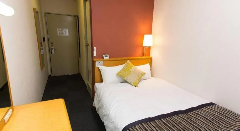 Bed in Hotel AreaOne Miyazaki City