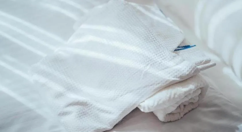 Bed in Hotel AreaOne Miyazaki City