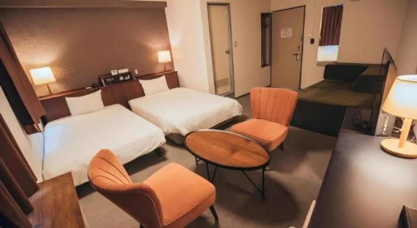 Bed in Hotel AreaOne Miyazaki City