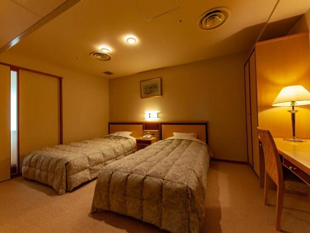 Bed in Hotel Takeshima