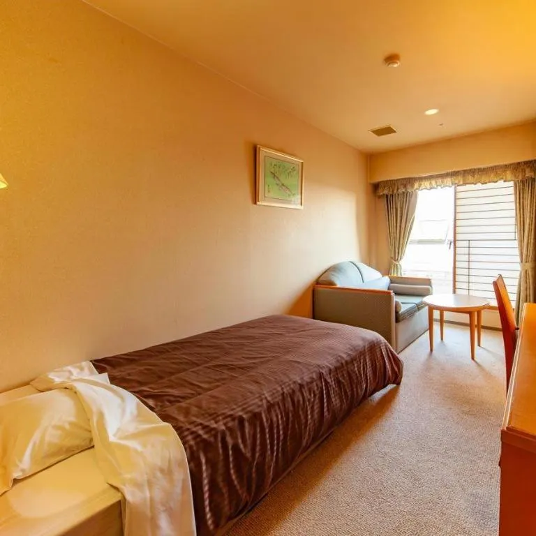 Bed in Hotel Takeshima