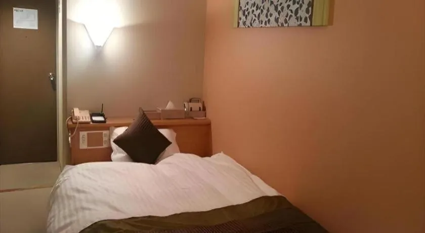 Bed in Hotel Matsumotoro