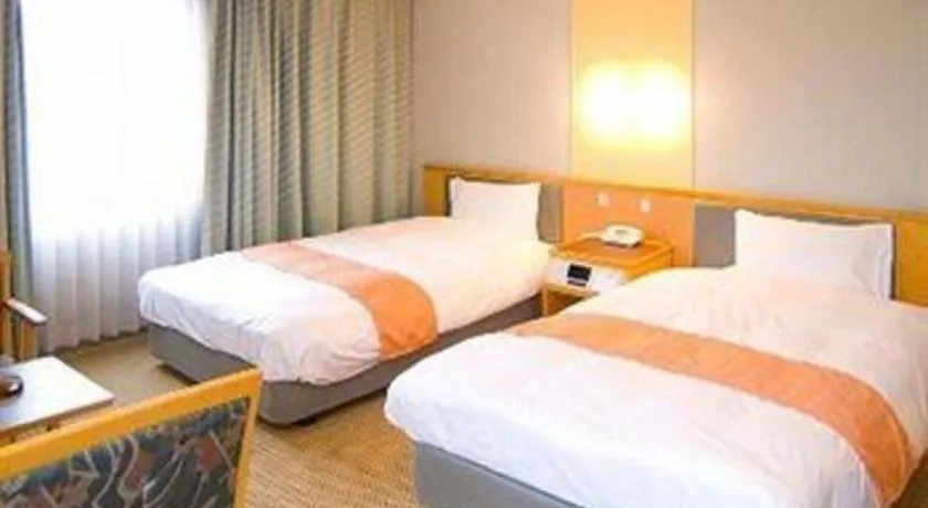 Bed in Takamatsu Park Hotel