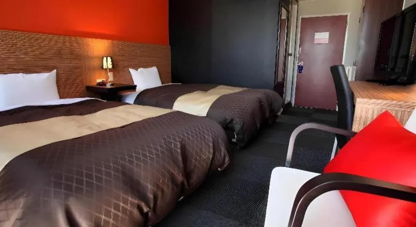 Bed in Hotel 1-2-3 Kofu Shingen Onsen