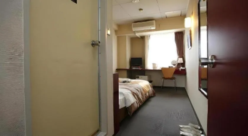 Bed in Hotel 1-2-3 Kofu Shingen Onsen