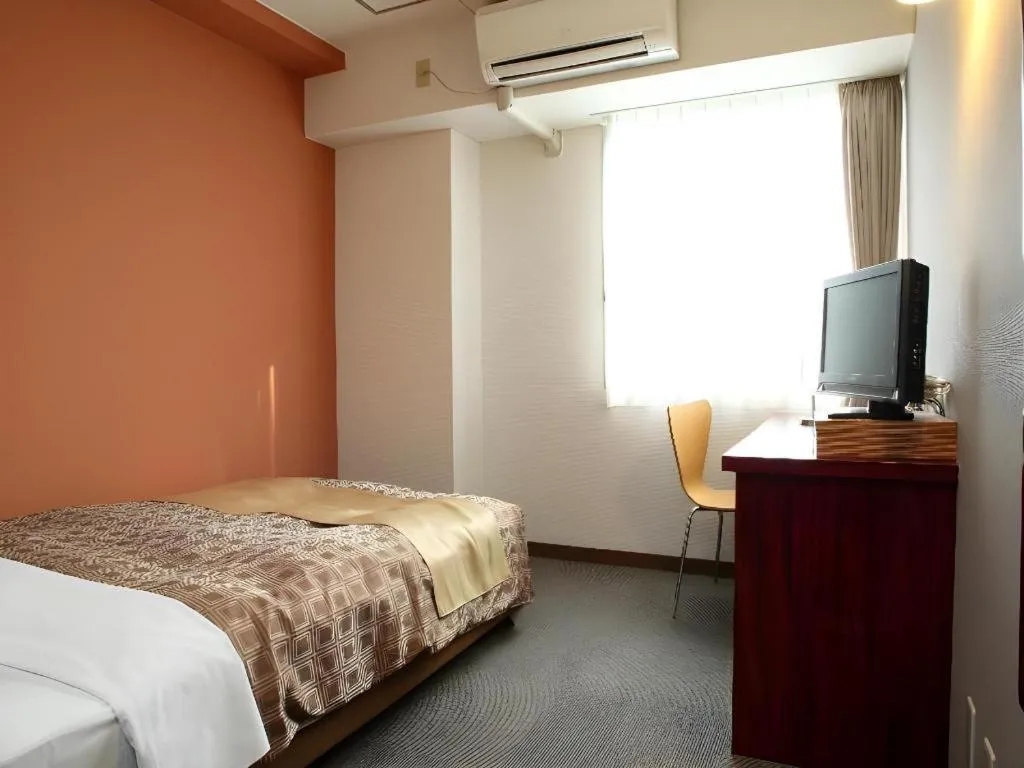 Bed in Hotel 1-2-3 Kofu Shingen Onsen