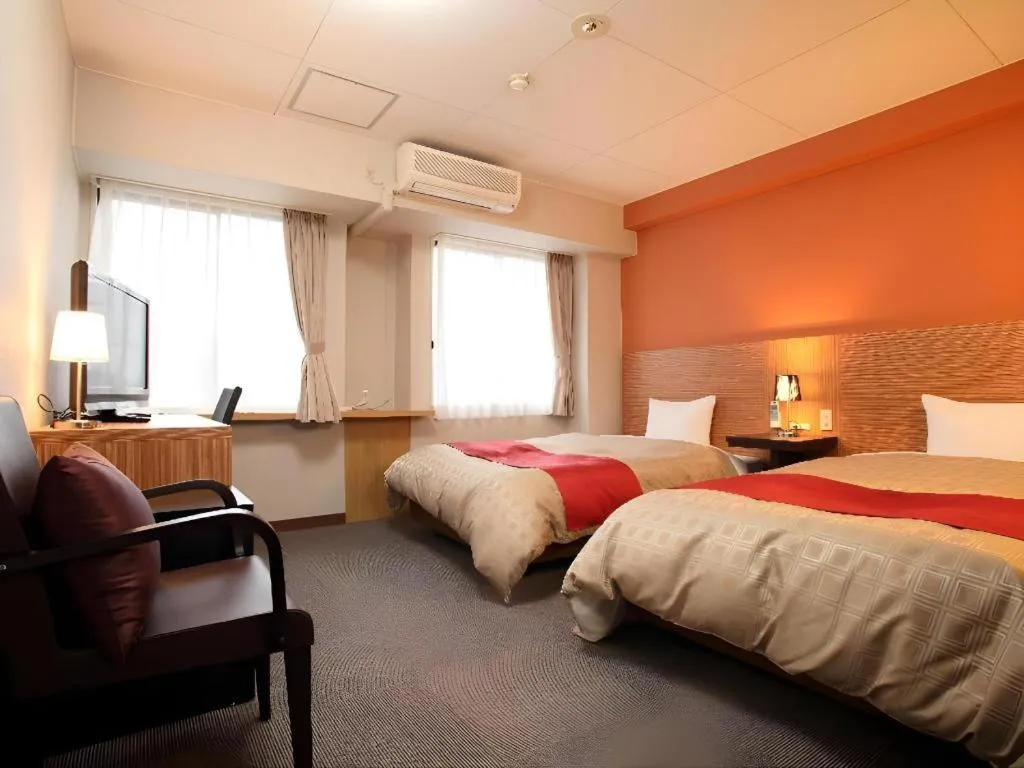 Bed in Hotel 1-2-3 Kofu Shingen Onsen