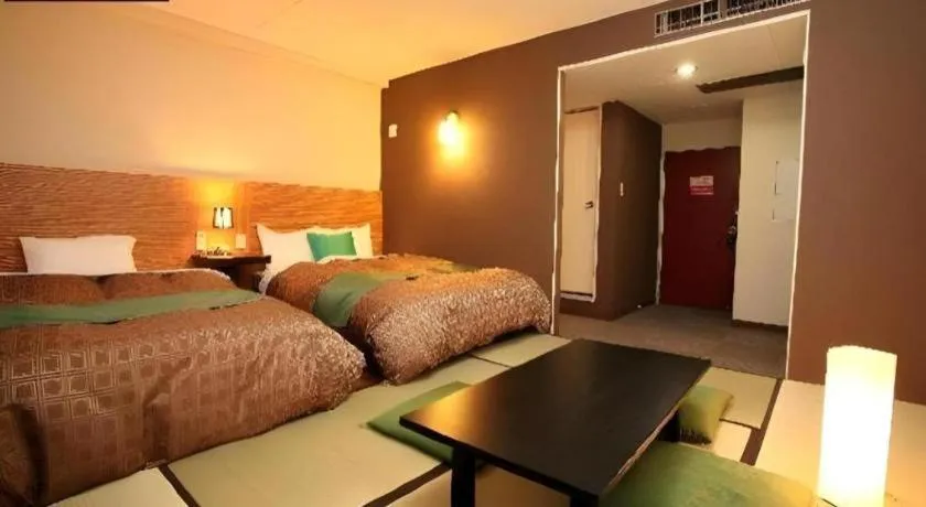 Bed in Hotel 1-2-3 Kofu Shingen Onsen