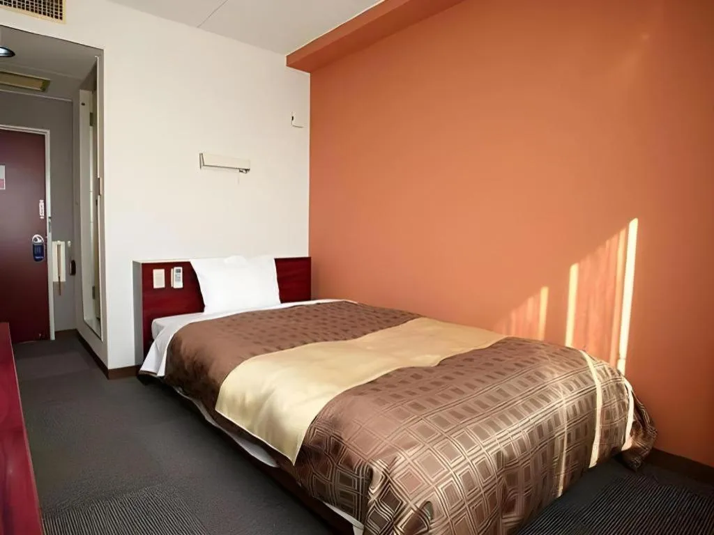 Bed in Hotel 1-2-3 Kofu Shingen Onsen