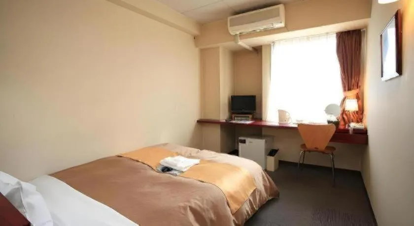 Bed in Hotel 1-2-3 Kofu Shingen Onsen