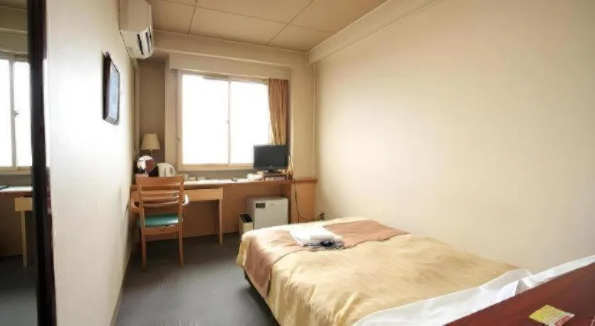 Bed in Hotel 1-2-3 Kofu Shingen Onsen