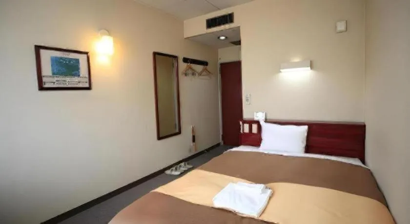 Bed in Hotel 1-2-3 Kofu Shingen Onsen