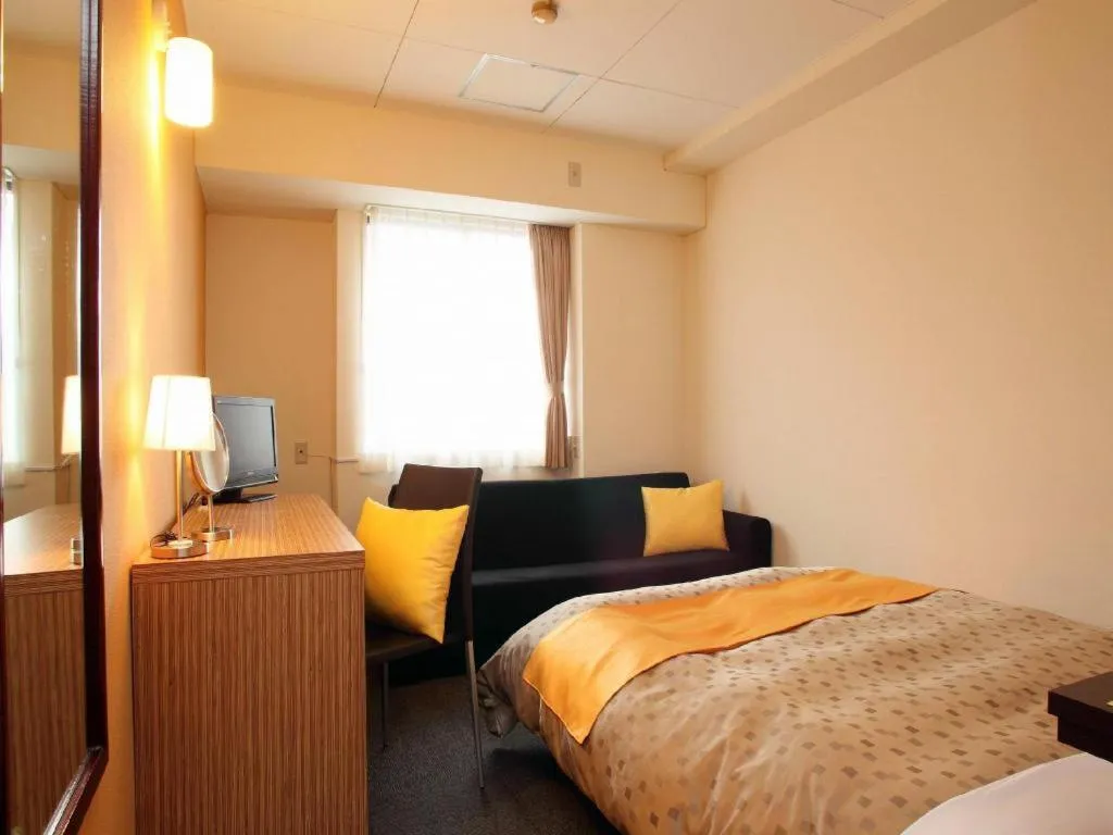 Bed in Hotel 1-2-3 Kofu Shingen Onsen