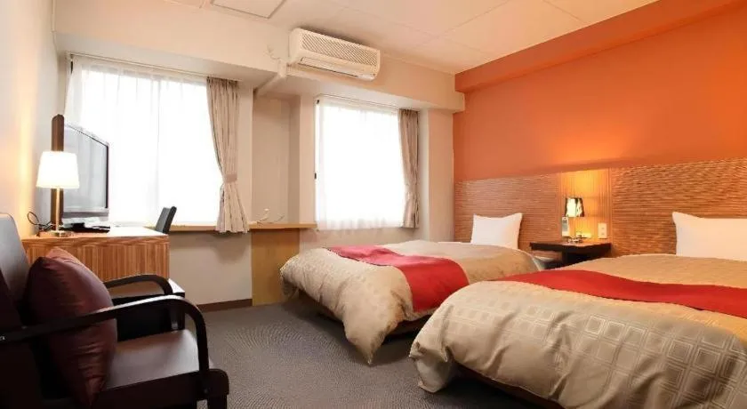 Bed in Hotel 1-2-3 Kofu Shingen Onsen