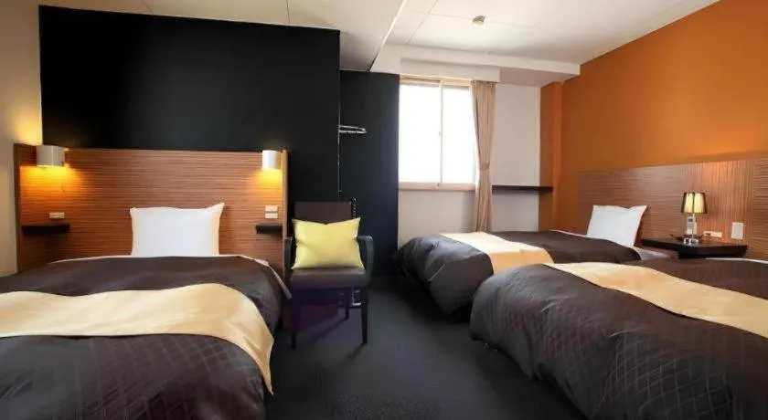 Bed in Hotel 1-2-3 Kofu Shingen Onsen