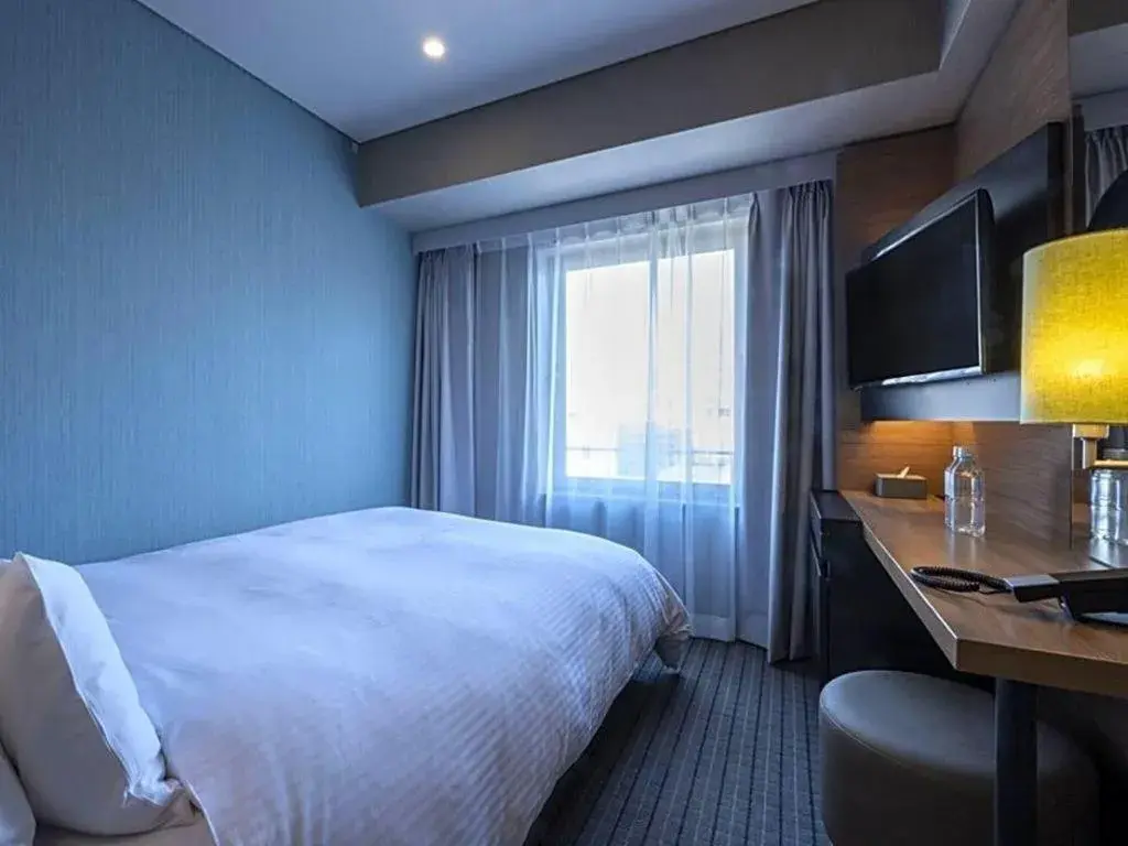 Bed in HOTEL UNIZO Osaka Yodoyabashi Bed in HOTEL UNIZO Osaka Yodoyabashi