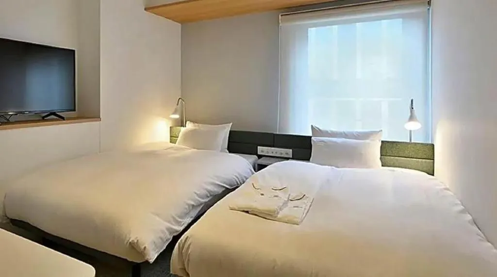 Bed in HOTEL UNIZO Osaka Yodoyabashi