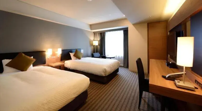 Bed in HOTEL UNIZO Osaka Yodoyabashi Bed in HOTEL UNIZO Osaka Yodoyabashi