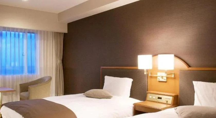 Bed in Imazu Sun Bridge Hotel