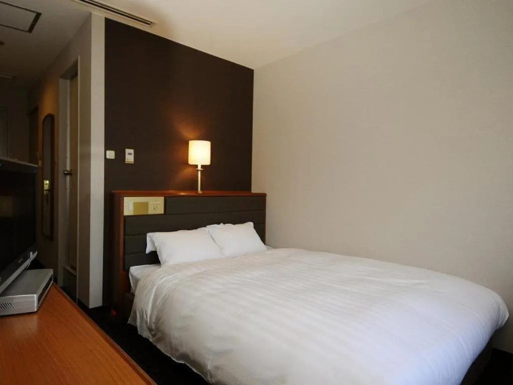 Bed in Imazu Sun Bridge Hotel