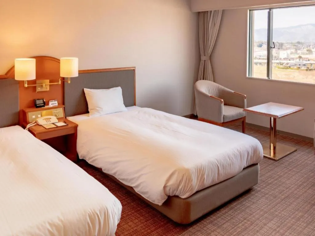 Bed in Imazu Sun Bridge Hotel