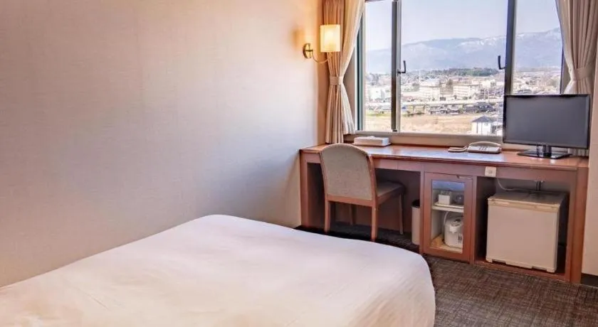 Bed in Imazu Sun Bridge Hotel